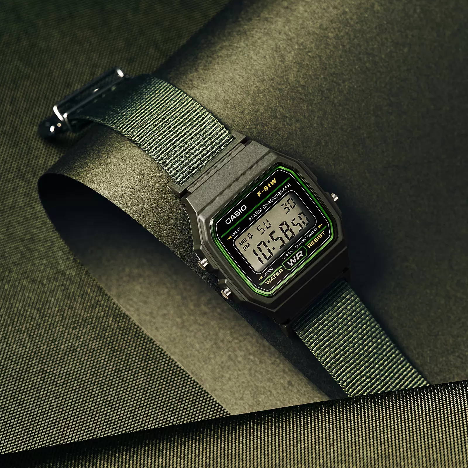 Close view of the Casio F-91WF-3A dial and green edge glow around its crystal