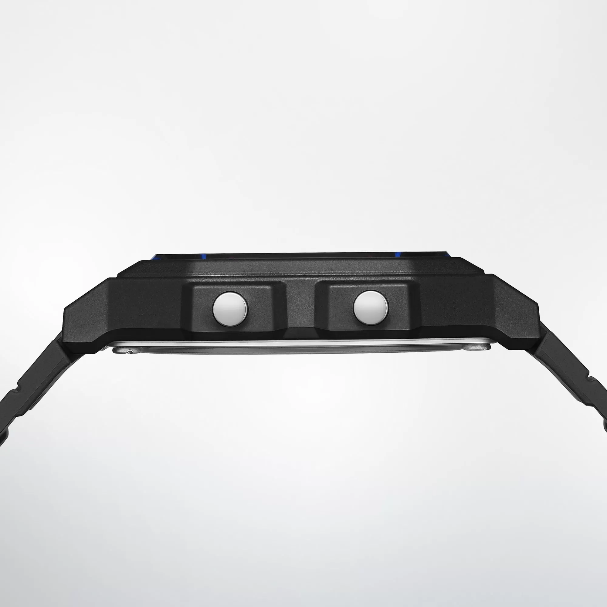 Side profile of the Casio F-B100W showing its slim resin case