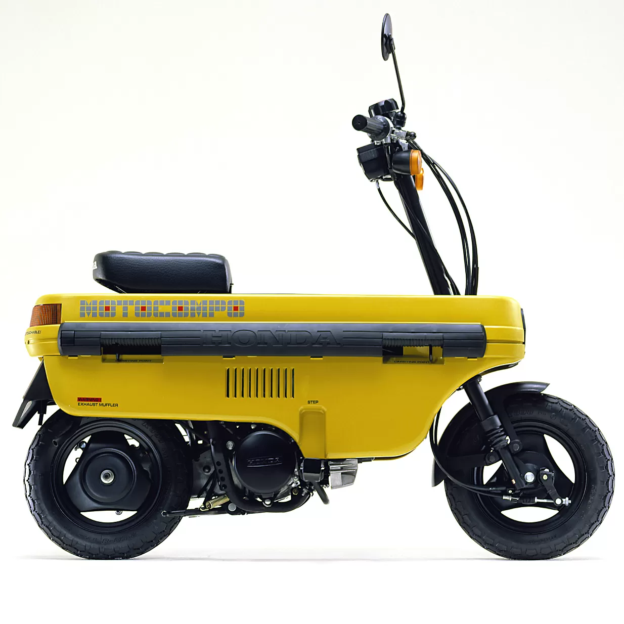 Scooter plegable Honda Motocompo amarillo de 1981