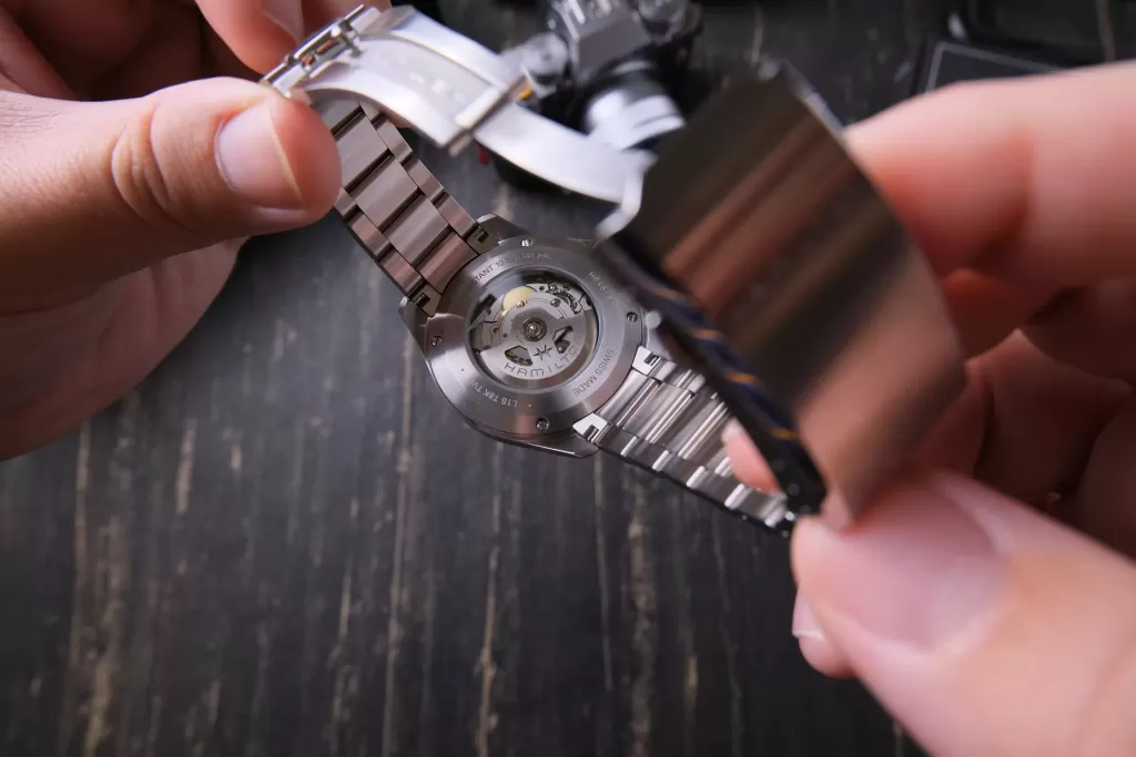 Hamilton H-40 movement and rotor visible through the Cooper caseback window