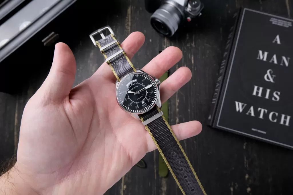 Hamilton Cooper held in my hand on a grey and khaki NATO