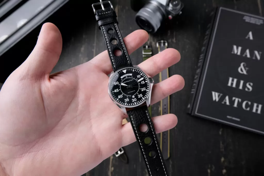 Hamilton Cooper held in my hand on a black racing strap