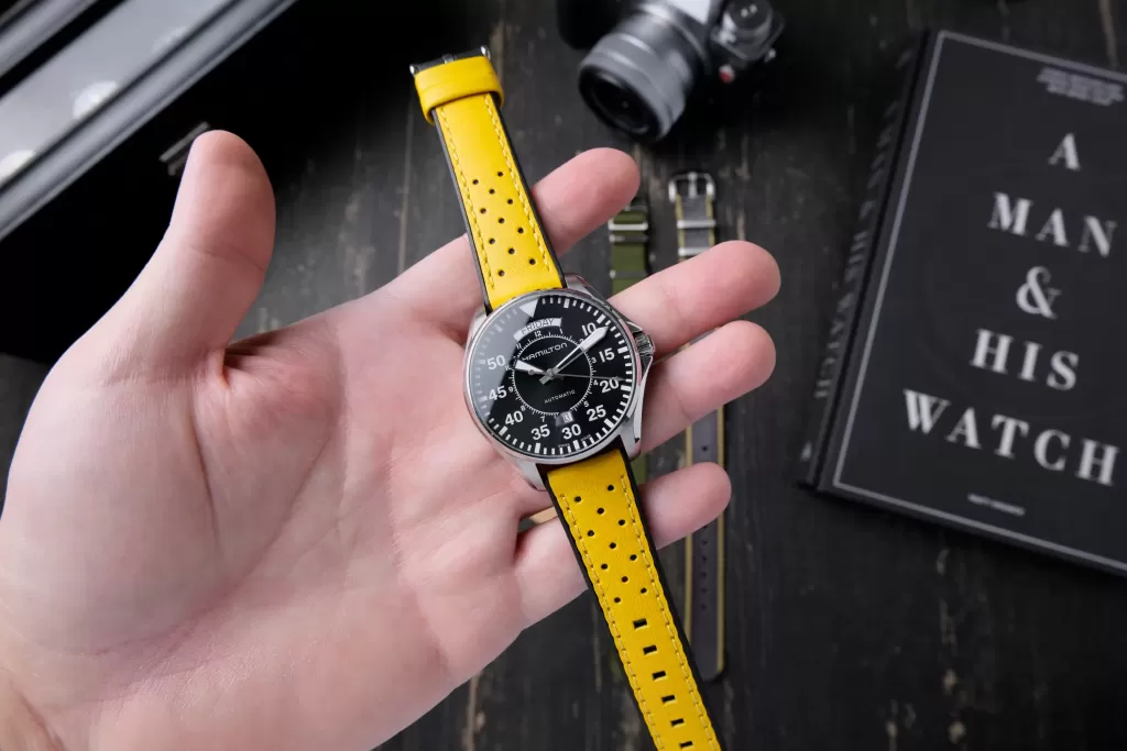 Hamilton Cooper held in my hand on a yellow strap